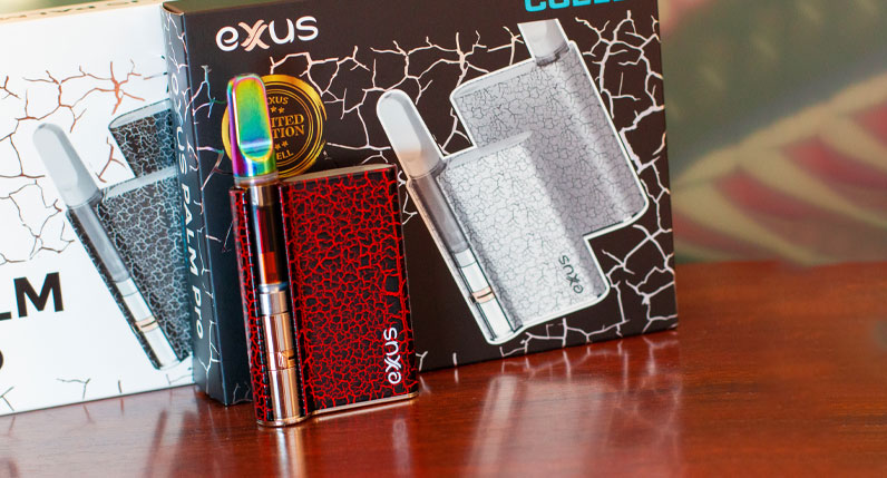 Exxus Palm Pro standing on reflective wooden surface